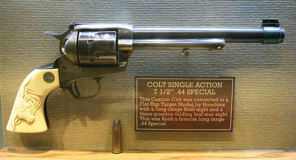 This 1917-era Colt Single Action Army .44 Special features a 71⁄2-inch barrel, Smith & Wesson adjustable rear sight, barrel band with gold bars on Patridge-style front blade sight, King short-action conversion and carved ivory stocks.